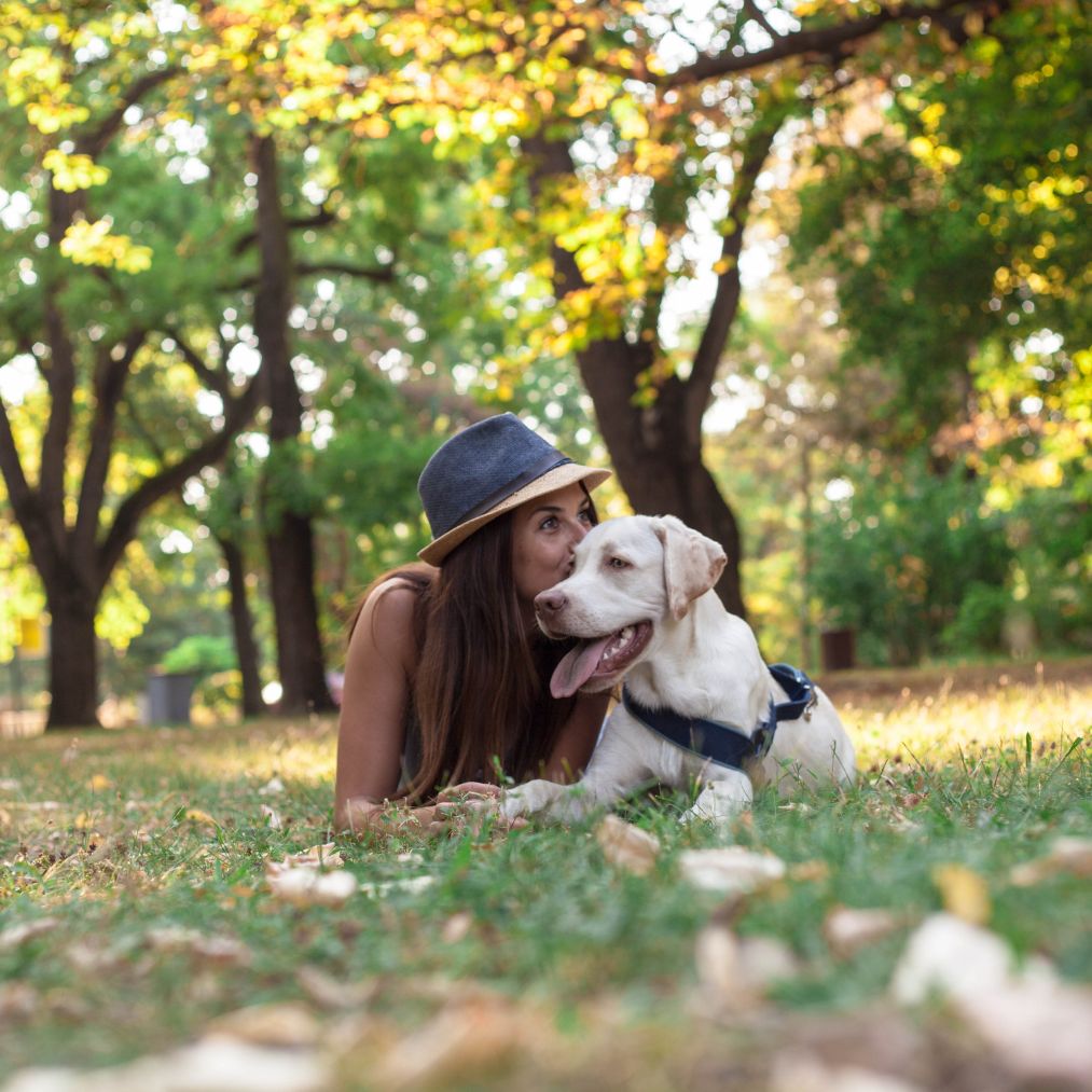 woman taking a break outside with a dog